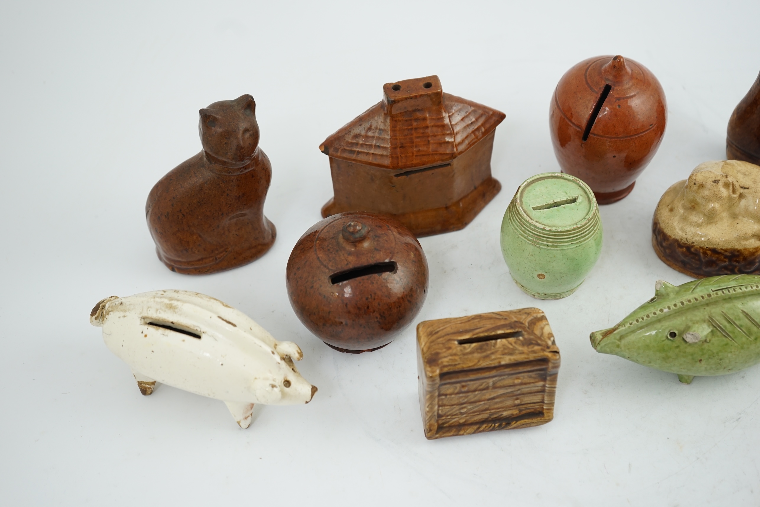 A collection of ten 19th century Dutch and British pottery money boxes